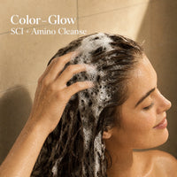 Color-safe solid shampoo bar being applied to wet hair